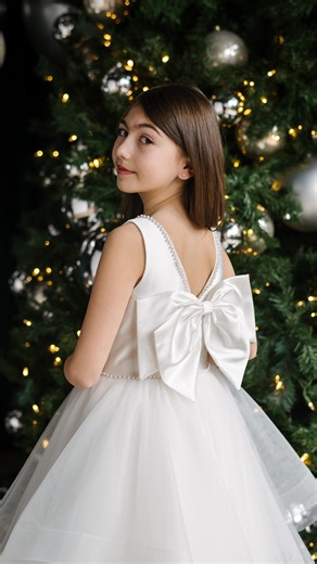 Top of her wish list ✨🤍 The Erica dress for her First Communion . . . satin communion dress, first communion, communion dresses 2026, communion dress, holy communion dress boutique, first communion dresses for girls, communion dress for girls #communion #communiondress #communiondresses #firstcommunion #firstcommuniondress | Teter Warm