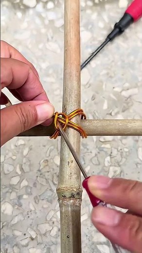 A simple method of tying cross bamboo poles with wire