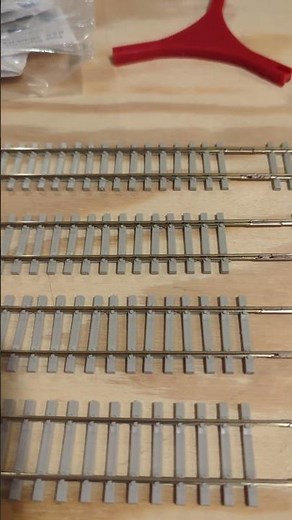 Prepping main line Peco flex track for installation.