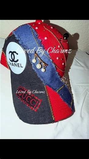 Kinda Bougie Designer Inspired ✨ This trucker is everything! This trucker features Red in color with a pop of black and blue denim. Embellished with gold chains & bling to give it an extra unique touch ✨ 🚨YOU CANNOT FIND IN STORES 🚨 Elevate you hat game today with my unique trucker. You won’t be disappointed! ✨DmToOrder🛍️ or check out my TikTok shop✨ #MadeWithLoveForYou #explorepage✨ #ViralReelsVideo #CharmzDidIt #FYP