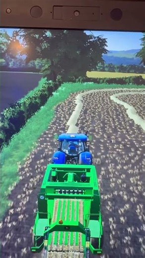 New Holland baking with a John Deere baler fs19