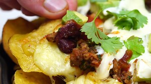 Fully-loaded beef nachos (bet we had you at fully). Full recipe: https://bit.ly/2WZGj1D | Taste.com.au