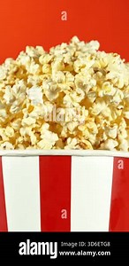 Super Slow Motion of Exploding popcorn from Bucket. Studio Shot of Flying Food. Filmed on High Speed Cinema Camera, 1000fps. Vertical Aspect Ratio Stock Video Footage - Alamy