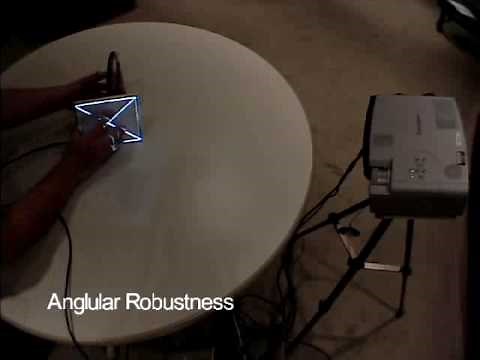 Automatic Projector Calibration with Embedded Light Sensors