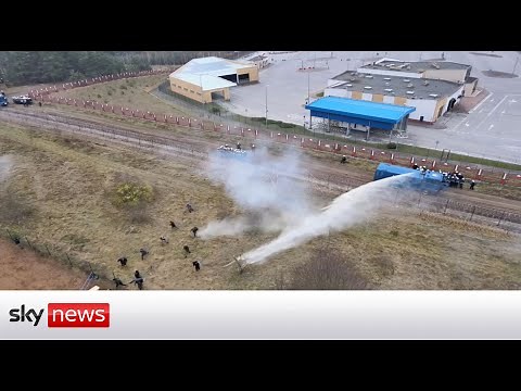 Poland-Belarus border: Border forces use water cannon on migrants