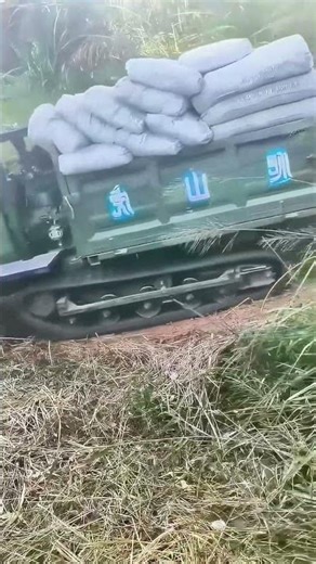 Track vehicle transports cement in mountainous areas, challenging rugged terrain!