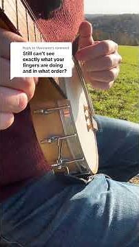Learning how to play the banjo clawhammer style with a close up of the frailing hand motion