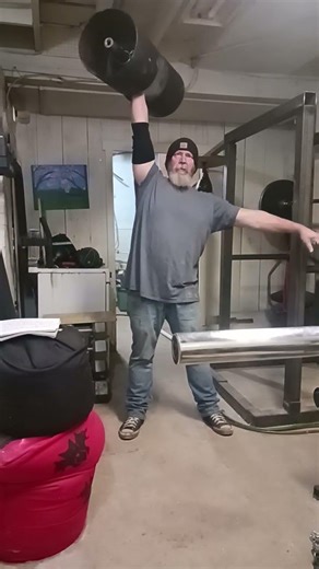 overhead press with circus dumbbell