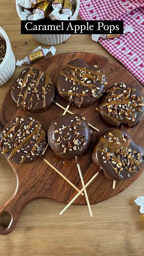 Sheri Wilson on Instagram: "Caramel Apple Pops 🍏 the best sweet and salty combo, and so easy to make for an after-dinner treat! Ingredients: 3 Green apples 1 bag Ghirardelli chocolate melting wafers 1/2 cup pecans, chopped 10 Whether’s chewy caramels Sea salt (optional) Melt the chocolate in a large cup according to the package directions. 2. Cut the apples into thick slices and pat dry with a paper towel. 3. Insert a skewer into each apple slice, then dip into the melted chocolate. 4. Add the