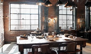 Industrial dining room with a metal table, leather chairs, and exposed brick walls, Video