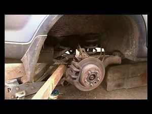 Honda CRV lower rear shock absorber bolt seized, broken spring and the fix.