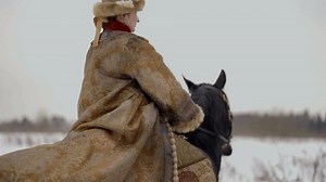 Grand Duchess of Kievan Rus riding horse, back view of lady in historical suit of 12 or 13 century