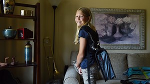 Sixth-grader invents spine-saving binder strap