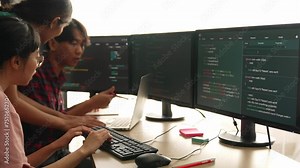 Slow motion back end software developer engineer for computer programming working together on debugging writing computing code, solving complex algorithms display on monitor in office. Burgeoning