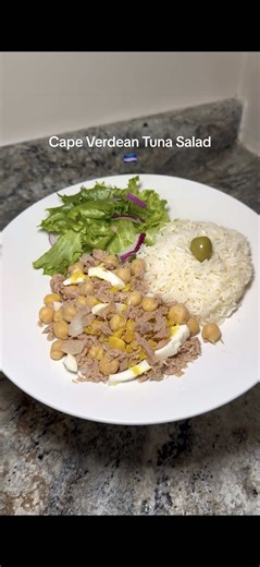 Cape Verdean tuna salad recipe🇨🇻 - mix Cape Verdean or Portuguese canned tuna, onions, chickpeas, boiled eggs, and olives with olive oil to curate the salad. Some people also like to add boiled potatoes but I’m not the biggest fan of it in my tuna salad. Let me know if you guys try this!!! follow for more Cape Verdean recipes! 🇨🇻🇨🇻🇨🇻 #f#fypt#trendingsongp#palops🇲🇿🇨🇻🇬🇼🇧🇷🇵🇹🇦🇴🇰🇳🇸🇹🇹🇱c#caboverded#discoverfood