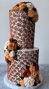A towering cake with hours of detailed work behind it? You know we had to show this off 👀 Our decorating team went all in on this one—every bit of that intricate buttercream pattern was piped by hand! Topped it off with delicate buttercream flowers to bring the whole look together. Watching this creation come to life was something special 😍 #pnwbakery #cakedecorating #cakedetail #buttercream #celebritycakestudio #customcake #weddingcake #localbakery #pnwcake | Celebrity Cake Studio
