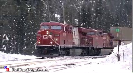 Two Canadian Pacific westbounds and one eastbound at the east portal of Mount Macdonald Tunnel. From the Highball Productions show "A Rocky Montain Winter" https://rfd.video/RockyWinter | Railfan Depot