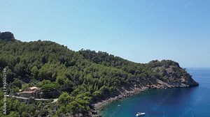 Cala Tuent Bay with Yachts Anchored in Mallorca's Serene Mountainous Coastline