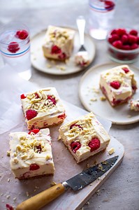 Raspberry & White Chocolate Cheesecake Bars | For a sweet weekend pick me up, these cheesecake bars here are no-bake, take minimal fuss and are so easy to make. This version is a riff off a recipe I’ve been making for years due to the oohs and aahs they almost always garner! Serves: 12 Time: 30 mins chilling time 200g plain digestive biscuits 100g unsalted butter 400g good-quality white chocolate, broken into pieces 250g full-fat cream cheese 200ml double/heavy cream 250g mascarpone cheese 250g 