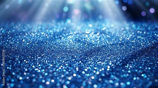 A mesmerizing closeup of shimmering blue glitter illuminated by ethereal light rays from above creating a magical and sparkling abstract background perfect for festive celebrations luxurious events o.