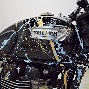 1.6K views · 40 reactions | Own the Ultimate Collectible. The genuine Bonneville T100 ridden by Chase McQueen to create the larger-than-life Michael Kalish portrait of Steve McQueen is available for auction. This one of one bike will be paired with the most rare asset of the ‘King of Cool Racing Team’ Drop. This Ultimate Collectible auction is live until July 21st. Bid on this bike now: mcqueen.thetadrop.com | Triumph Motorcycles | Facebook