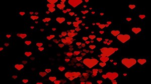 Download A romantic looping animation featuring red paper craft hearts falling like particles for Valentine's Day. for free