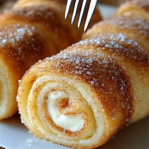 Cinnamon Sugar Cream Cheese Rolls Ingredients: Shortcut Version (with Crescent Rolls or Puff Pastry): - 1 package (8 oz) refrigerated crescent roll dough (or puff pastry sheet) - 8 oz cream cheese, softened Cinnamon Sugar Cream Cheese Rolls Cinnamon Sugar Coating: - 1/2 cup unsalted butter, melted - 1/2 cup granulated sugar - 1 tablespoon ground cinnamon Homemade Dough Option: - 2 1/4 teaspoons active dry yeast (1 packet) - 1/2 cup warm milk (110°F / 43°C) - 2 tablespoons granulated sugar - 2 1/