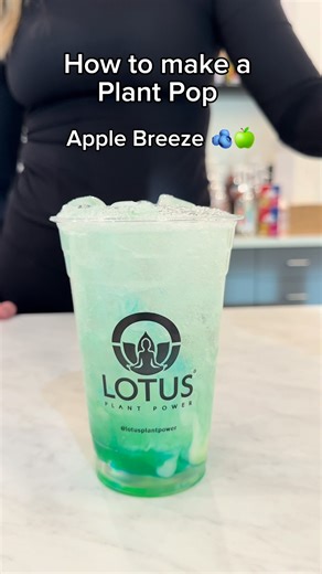Lotus Plant Power on Instagram: "Meet Apple Breeze 🫐🍏 Our first featured Plant Pop® recipe and your new clean soda fave. Plant Pop® + Blue Raspberry + Green Apple + Cream = unmatched function and flavor. For a 20 oz cup: 🧊 Fill with ice 🌱 1.5 oz Plant Pop 🍏 0.25 oz green apple 💙 0.25 oz blue raspberry 🥛 0.5 oz Lotus cream base 💧 Top with soda water ✨ Mix and enjoy Save this for your next drink run! Plant Pop® is clean label, non-caffeinated, and school compliant 🌱"