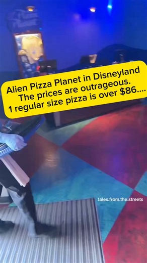 American is at Alien Pizza Planet in Disneyland to get food He shows the menu, the prices are outrageous. 1 regular size pizza is over $86.... How did Americans ever let corporations normalize ripping us off this hard #disney | Florida Must-Visit