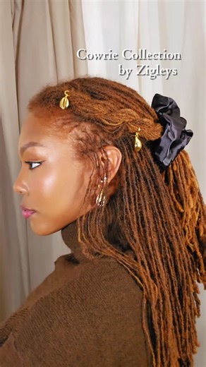 Locs And The City | Hair, Life, Beauty on Instagram: "Modern goddess energy ✨ Cowries symbolize protection, health, and divine feminine power and this heirloom-worthy Cowrie Collection brought that energy to an everyday look of mine. Real 18k gold, signature lock, and shake-test secure. I'm wearing 5 total Cowrie from the newest collection @Zigleys. I personally like that they can double as earrings , which make them very versatile as far as putting together looks. Learn more in the LTK app. #AD