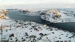 Filming location of the film Leviathan directed by Zvyagintsev. Village and bridge in the north of Russia. The harsh climate of the Kola Peninsula. Snow-covered shores of Teriberka