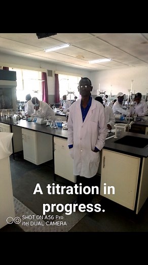 Students carrying out a Titration experiment in the Laboratory. | Online Combined Science TUTOR