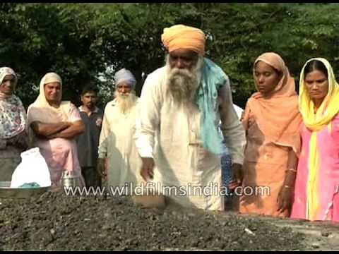 Sikh family collect ashes after cremation of a family member