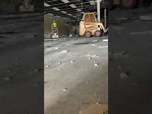 VCT tile floor demo. With bobcat scraper