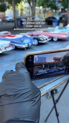 Anthony Schmidt Photography on Instagram: "A lot of you already know Anthony’s story but in case you don’t he’s a young man on the autism spectrum with an incredible talent for miniature car photography. These are all miniature die-cast toy cars, he sets up against real life historical buildings and photographs at just the right angle to make them appear life sized. His photos take you to another time and place. Every year he comes out with a calendar and the 2026 calendar is available now at ht