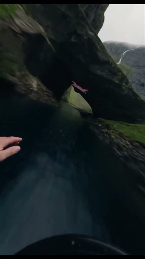 Flying this close to the cliff is insane! #extremesports #wingsuit