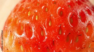 Discover the world of strawberries through a captivating macro video shot with a probe lens. Witness their vibrant colors and intricate textures up close. Fruit concept. Strawberry background. 4K