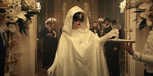 Watch Emma Stone’s Cruella Shock a Dinner Party—and Emma Thompson—With Her Fiery Debut