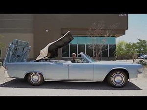 1965 Lincoln Continental Convertible laying the top down