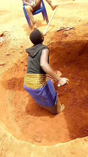 Manual Labor: Digging Soil in an Outdoor Setting