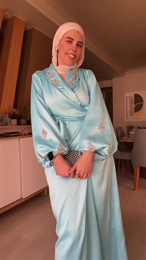 Rania Nehal Mohamed on Instagram: "Wrapped in elegance and sparkles. 💎✨ This icy blue satin dress is a total dream come true! modest fashion, satin dress, wedding guest, hijab style, evening wear, embellished, teal #modestfashion #hijabstyle #weddingguest #satindress #ootd fashionreel"