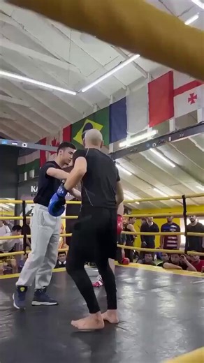 Boxer drops arrogant influencer with one punch after he tries to sucker punch him.