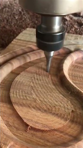 automated wood carving process using cnc router machine to create intricate patterns on timber