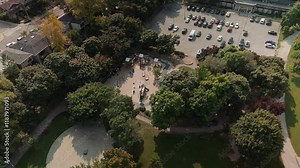 Stunning Aerial View of a Baseball Field Enveloped by Lush Trees and Nearby Houses in the Community Area
