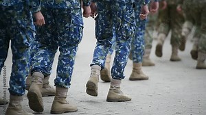 Soldiers in marching formation during military recruitment