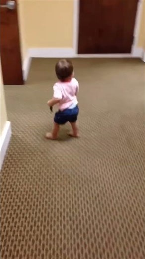 Baby runs into wall learning to walk