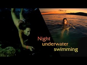 Underwater swimming in the darkness in the sea