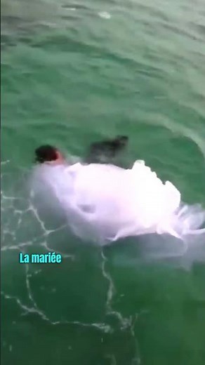 This Woman Jumps Into The Water With Her Wedding Dress And...