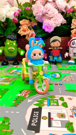 Cute blue rabbit riding a bike around