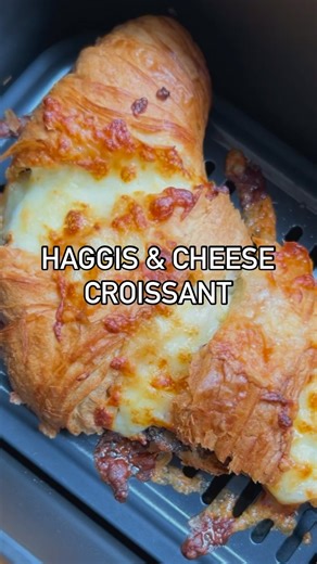Air fryer Haggis and Cheese Croissant. I’m not sure haggis croissants have gone viral yet but they should. Flaky, cheesy haggisy goodness 😋 1️⃣ Microwave haggis slice for 2 mins. 2️⃣ Slice croissant and spread the haggis. 3️⃣ Cut slices in the top of the croissant and add a mixture of grated cheddar and mozzarella. 4️⃣ Bake in air fryer for 7 mins at 180. ABSOLUTELY DELICIOUS!!! I saw somewhere you should rinse shop bought grated mozzarella in order to get a cheese pull. I tried it and it’s saf